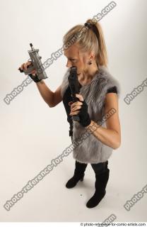18 2018 01 NIKOL STANDING POSE WITH TWO GUNS